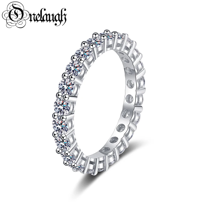 Onelaugh 925 Silver 0.1ct Total 2.2ct D Color Moissanite Eternity Wedding Band Ring for Women Full Enternity Diamond Ladies Ring
Onelaugh 925 Silver 0.1ct Total 2.2ct D Color Moissanite Eternity Wedding Band Ring for Women Full Enternity Diamond Ladies Ring