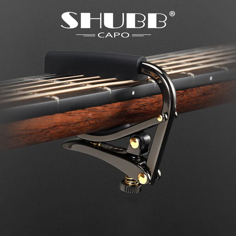 

SHUBB Capos. SHUBB capo limited edition: C1-KZ black goldcapos. Suitable for acoustic/electric guitar.