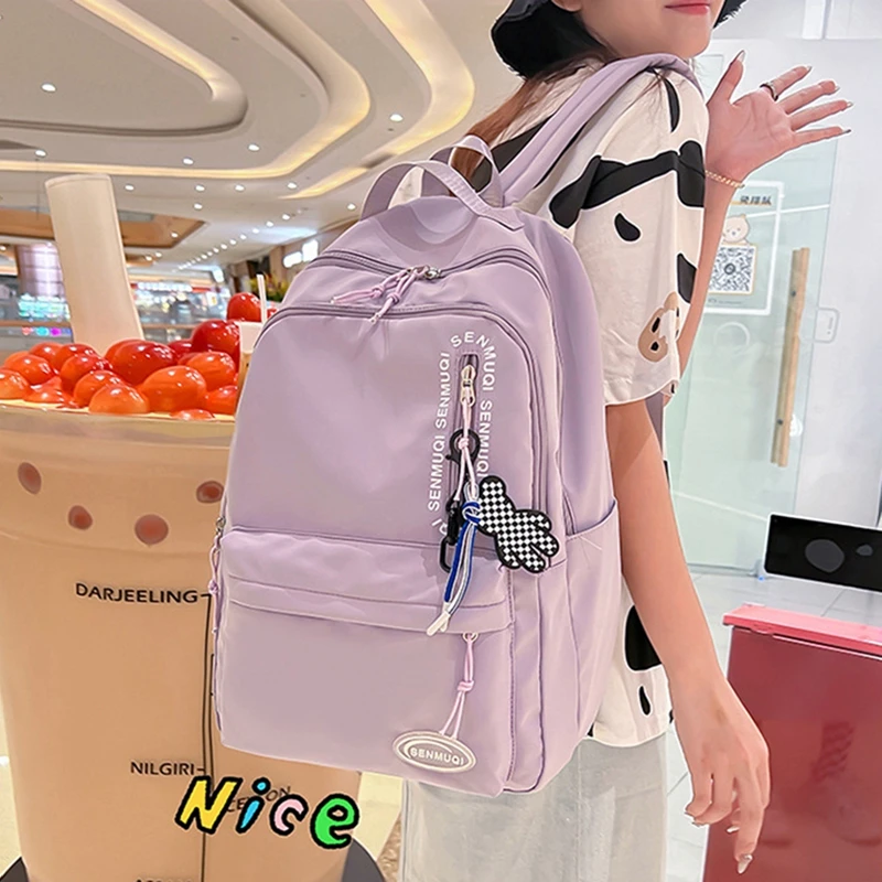 Ladies Travel Backpack Solid Color Lightweight Nylon Backpack School Bag with Cute Send Pendant Pendant School Travel Outdoor
Ladies Travel Backpack Solid Color Lightweight Nylon Backpack School Bag with Cute Send Pendant Pendant School Travel Outdoor