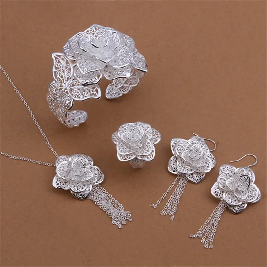 New Silver Color Jewelry Set Charm Elegant Hollow Big Flowers Necklace Bangles Dangle Earrings Ring Fashion Party Jewelry
New Silver Color Jewelry Set Charm Elegant Hollow Big Flowers Necklace Bangles Dangle Earrings Ring Fashion Party Jewelry