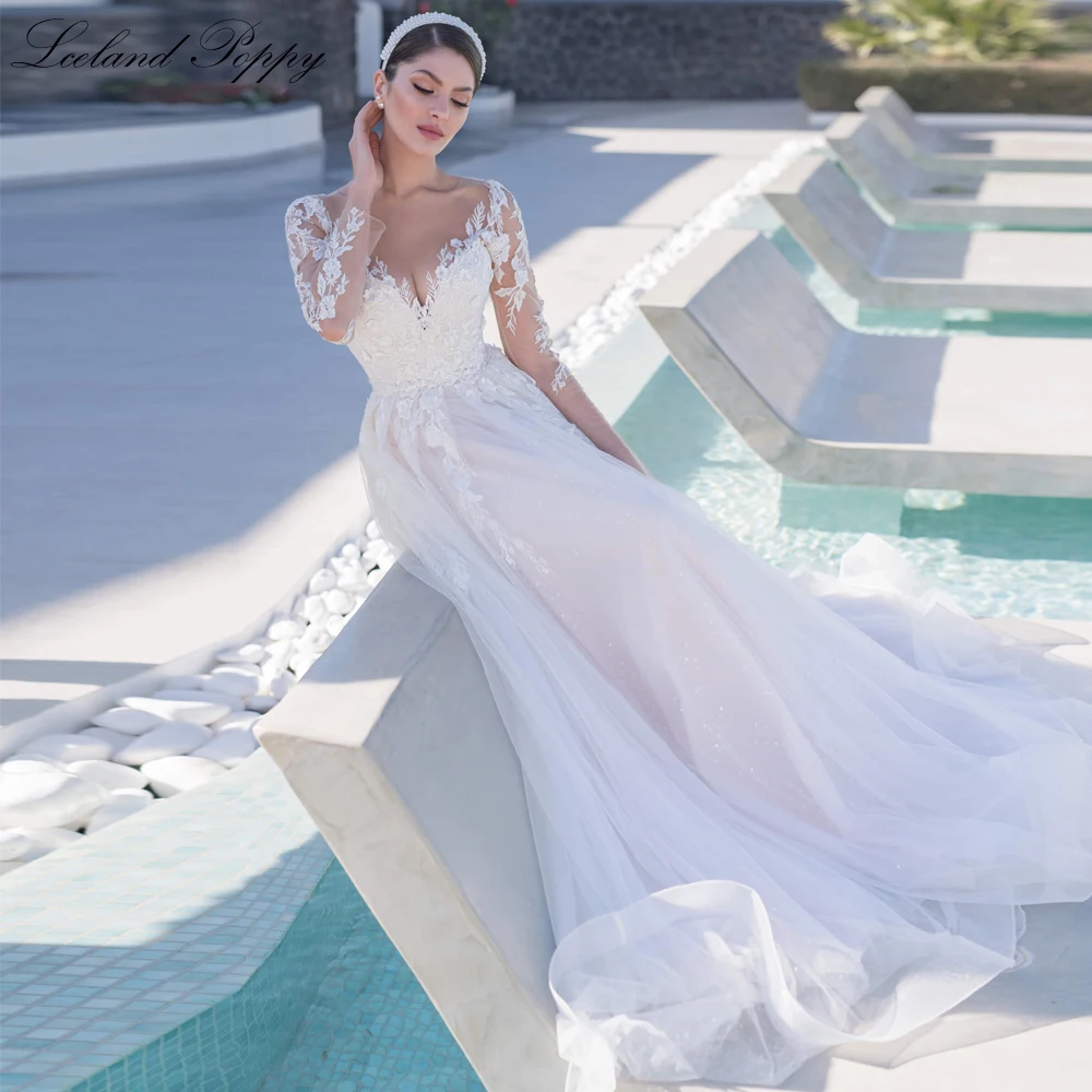 Lceland Poppy A Line Scoop Neck Tulle Wedding Dresses Long Sleeves Floor Length Shiny Bridal Gowns with Court Train
Lceland Poppy A Line Scoop Neck Tulle Wedding Dresses Long Sleeves Floor Length Shiny Bridal Gowns with Court Train