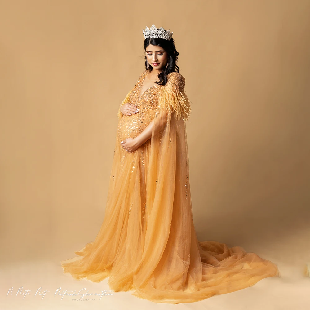 Sparkle Beading Empire Waist Maternity Styled Photoshoot Dress Leg Opening Custom Made Cape Train Homecoming Gown With Feathers
Sparkle Beading Empire Waist Maternity Styled Photoshoot Dress Leg Opening Custom Made Cape Train Homecoming Gown With Feathers