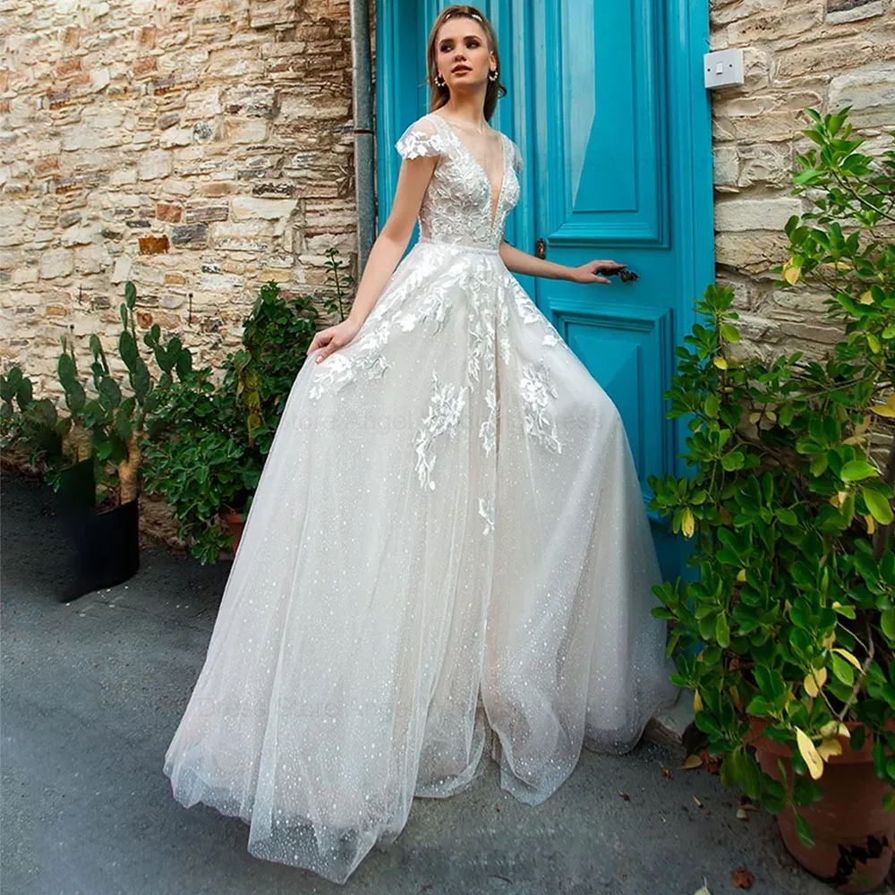 ANGEL Deep V-Neck Lace Wedding Dress 2024 Short Cap Sleeve Shining Tulle Custom Made Boho Appliqued Beading Pearls Bridal Gowns
ANGEL Deep V-Neck Lace Wedding Dress 2024 Short Cap Sleeve Shining Tulle Custom Made Boho Appliqued Beading Pearls Bridal Gowns