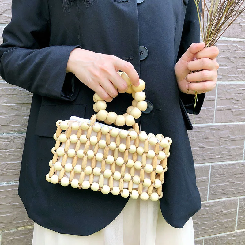

Retro New Ins Handmade Woven Beaded Bags Casual Simple Wooden Bead Handbag Niche Design Hollowed Out Beach Versatile Women's Bag