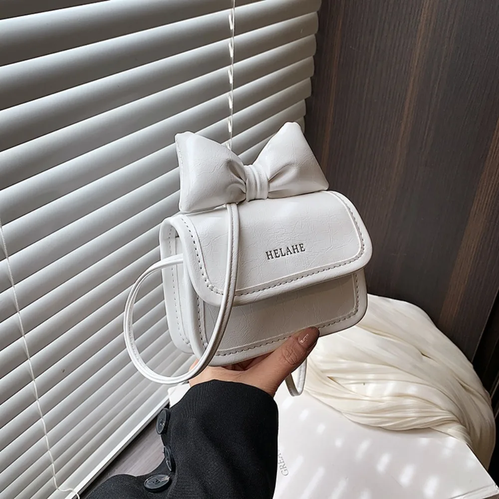 Однотонная мини-сумка через плечо, Корейская дизайнерская розовая сумка из искусственной кожи с бантом, роскошная милая сумка через плечо с клапаном 
Однотонная мини-сумка через плечо, Корейская дизайнерская розовая сумка из искусственной кожи с бантом, роскошная милая сумка через плечо с клапаном