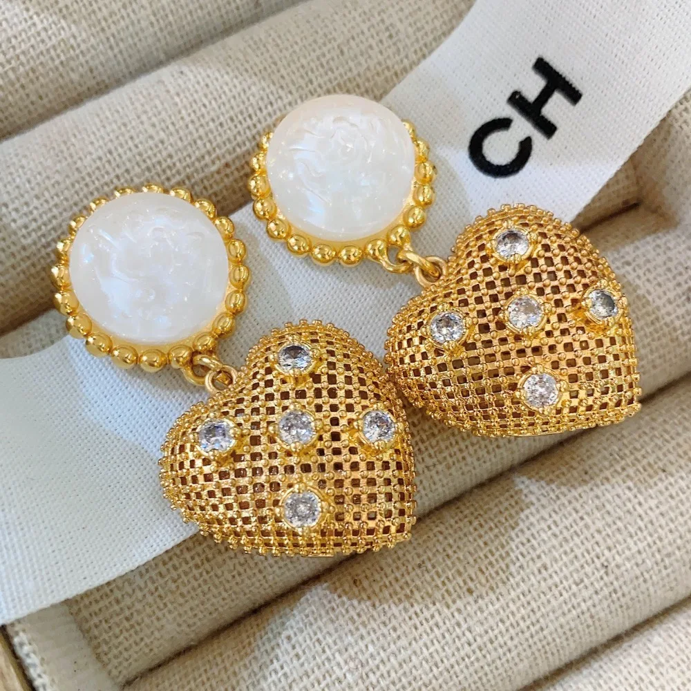 Heart shaped earrings French vintage golden earrings woven heart shaped pendant Charming women's jewelry Women's wedding gift
Heart shaped earrings French vintage golden earrings woven heart shaped pendant Charming women's jewelry Women's wedding gift