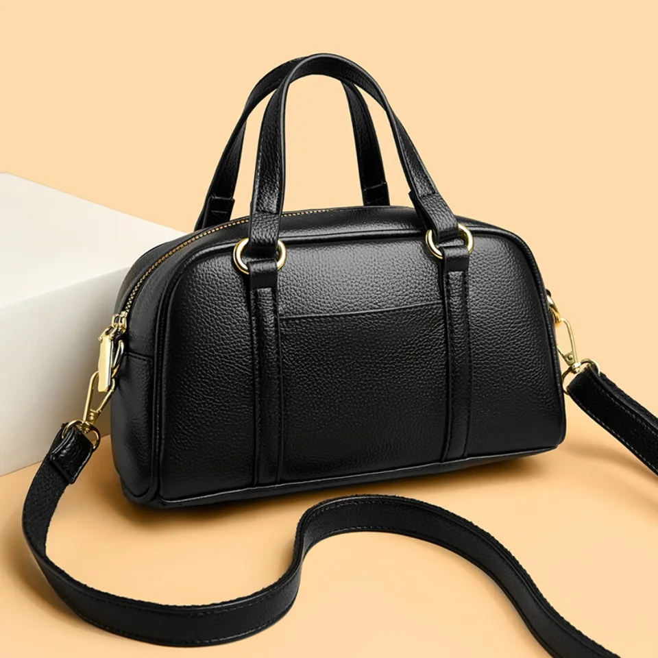 Soft leather shoulder bag for women with zipper closure and compact design
