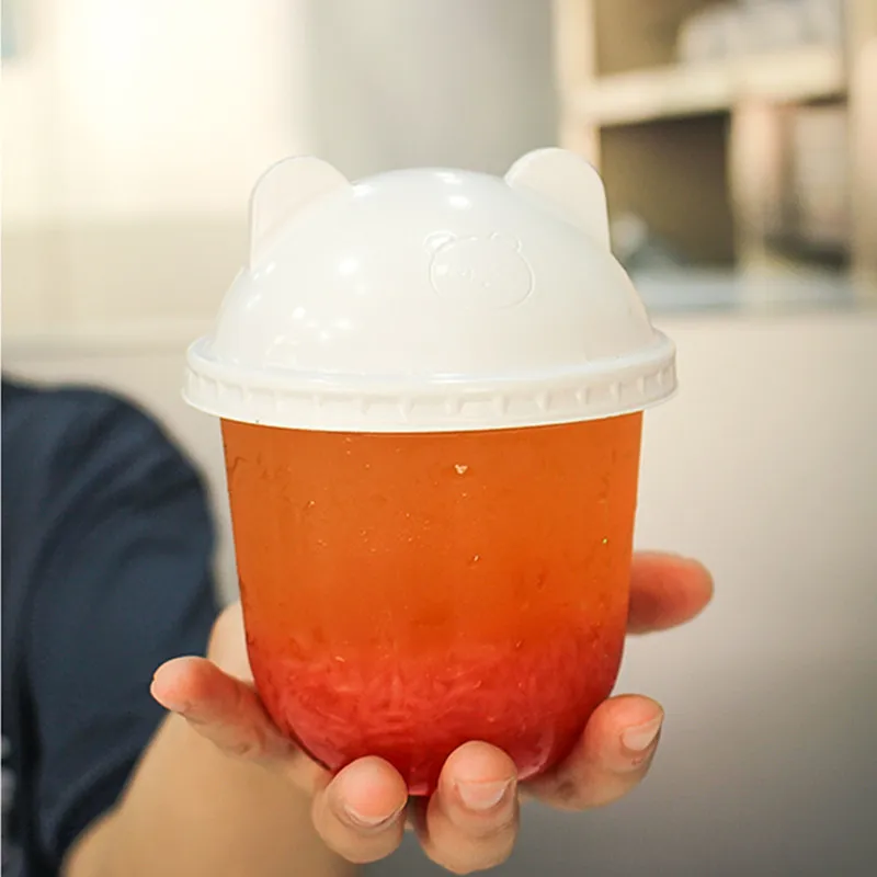 50pcs Net Red U Shape Cute Plastic Cups Birthday Party Favors Drinking Juice Bubble Tea Coffee Cup Pudding Dessert Cup With lid
50pcs Net Red U Shape Cute Plastic Cups Birthday Party Favors Drinking Juice Bubble Tea Coffee Cup Pudding Dessert Cup With lid