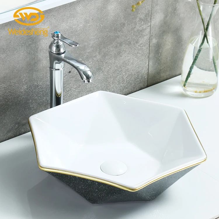 Floral innovation black diamond decoration hexagon art designed hand sanitary ceramic wash basin bathroom washbasin
Floral innovation black diamond decoration hexagon art designed hand sanitary ceramic wash basin bathroom washbasin