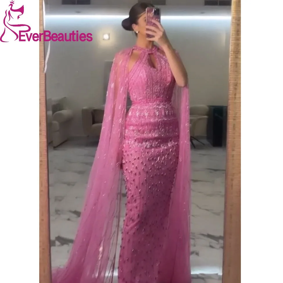 Mermaid Dubai Prom Dresses Saudi Arabia Luxury Beaded Party Gown with Cape Evening Dress High Neck Pink Formal Dress for Women
Mermaid Dubai Prom Dresses Saudi Arabia Luxury Beaded Party Gown with Cape Evening Dress High Neck Pink Formal Dress for Women