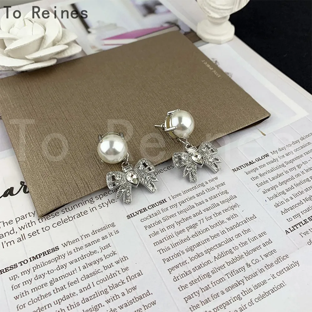 To Reines 2024 New 925 Silver Trendy Bow Pearl Earring Party Exquisitely Designed Ear Studs Elegant Ladies Birthday Jewelry Gift
To Reines 2024 New 925 Silver Trendy Bow Pearl Earring Party Exquisitely Designed Ear Studs Elegant Ladies Birthday Jewelry Gift