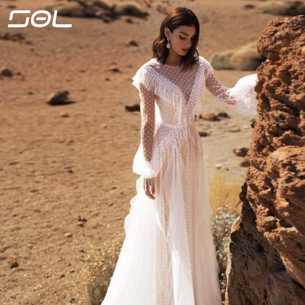 Sol Boho Long Puff Sleeves Tassel Wedding Dresses V-neck Lace A Line Bride Gown Open Back Romantic Court Train Bridal Dress
Sol Boho Long Puff Sleeves Tassel Wedding Dresses V-neck Lace A Line Bride Gown Open Back Romantic Court Train Bridal Dress