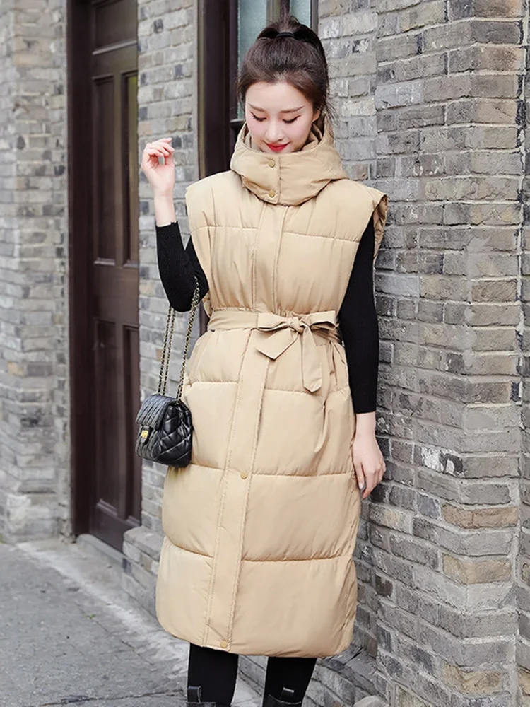 Зимнее длинное хлопковое пальто, жилет для женщин, куртки, Новая повседневная майка без рукавов, воротник-стойка, теплая пуховая куртка с капюшоном и поясом
Зимнее длинное хлопковое пальто, жилет для женщин, куртки, Новая повседневная майка без рукавов, воротник-стойка, теплая пуховая куртка с капюшоном и поясом