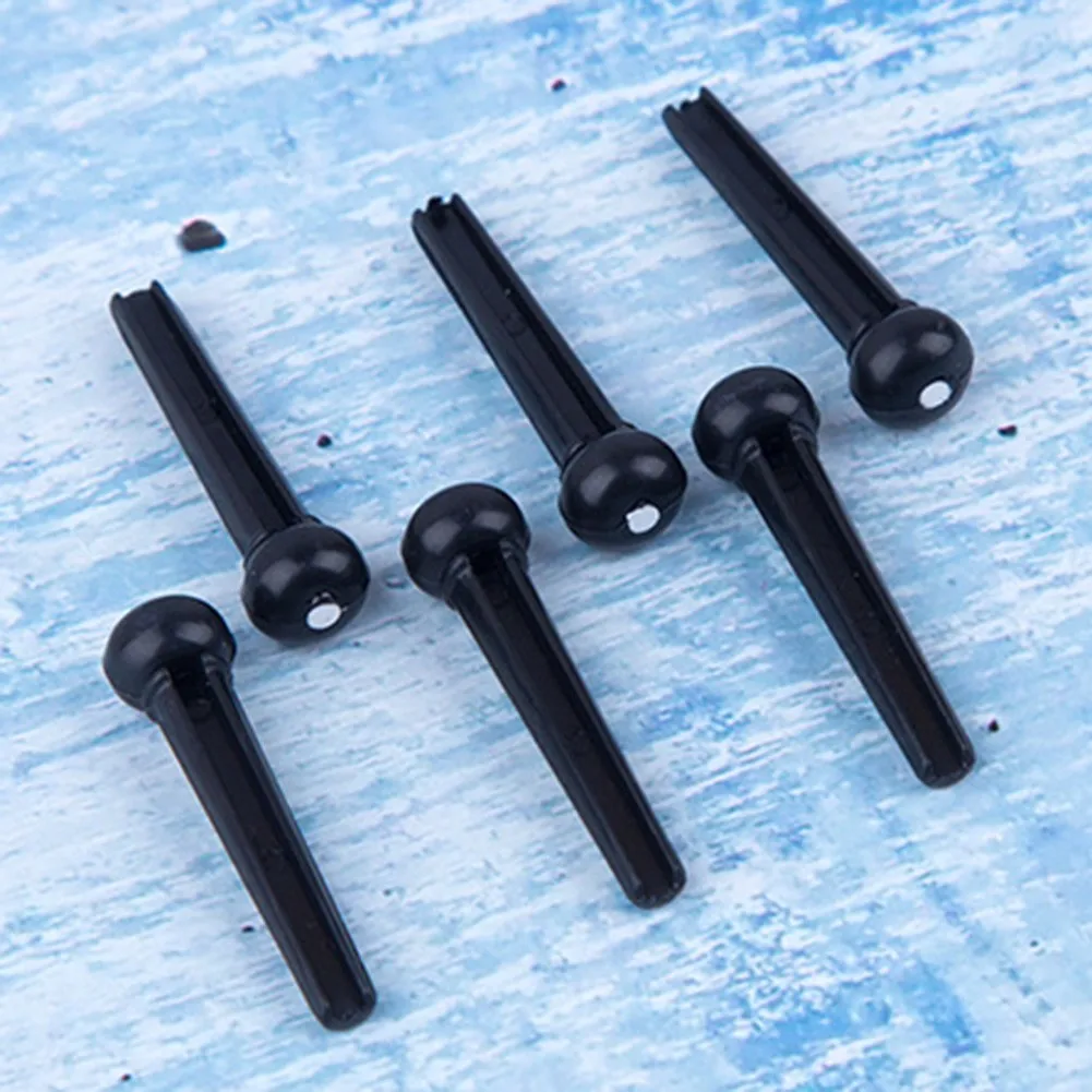 Portable 6-String Acoustic Guitar Bridge Pins Plastic String End Peg Connectors Saddle Nut Cattle Tailpiece Guitar Accessories
Portable 6-String Acoustic Guitar Bridge Pins Plastic String End Peg Connectors Saddle Nut Cattle Tailpiece Guitar Accessories