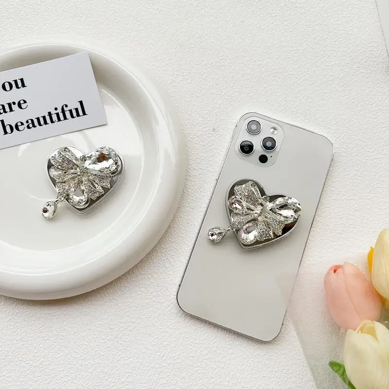 Rhinestone Bow Love Phone Bracket Light Luxury Back Stick South Korean Ins Wind Retractable Portable Watch Catch-up Drama
Rhinestone Bow Love Phone Bracket Light Luxury Back Stick South Korean Ins Wind Retractable Portable Watch Catch-up Drama