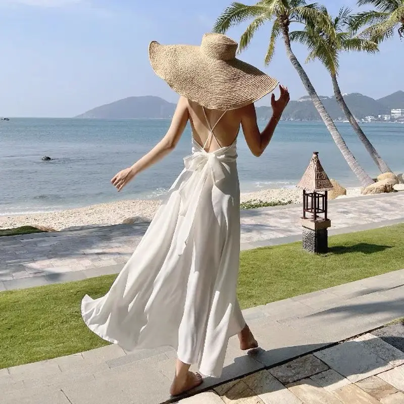 New Spring Summer Sexy Backless Waist Bow French Long White Suspender Dress V Neck Beach Style Satin Dress Vacation Style Dress
New Spring Summer Sexy Backless Waist Bow French Long White Suspender Dress V Neck Beach Style Satin Dress Vacation Style Dress