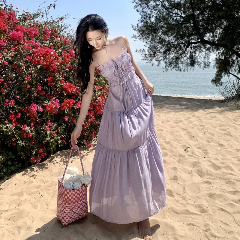 

French Sling Long Dress Female Design Sense Summer Hollow Stitching Waist Fairy Style Seaside Vacation Dress 2024 New