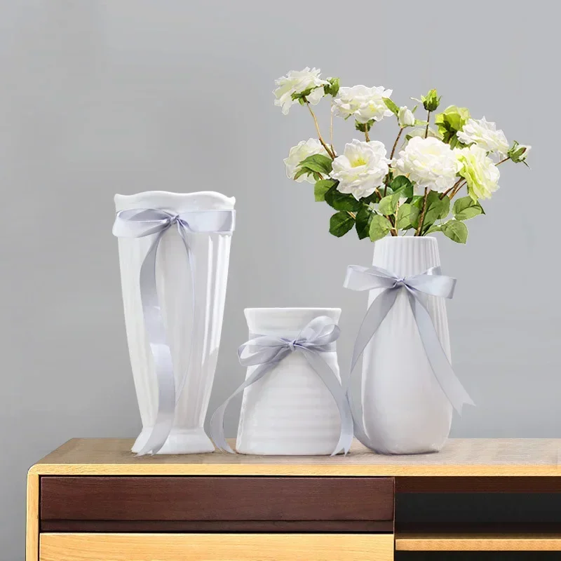 Modern ceramic bow vase Gift ribbon home decoration accessories beautiful vase for home decor parties and Christmas decoration
Modern ceramic bow vase Gift ribbon home decoration accessories beautiful vase for home decor parties and Christmas decoration