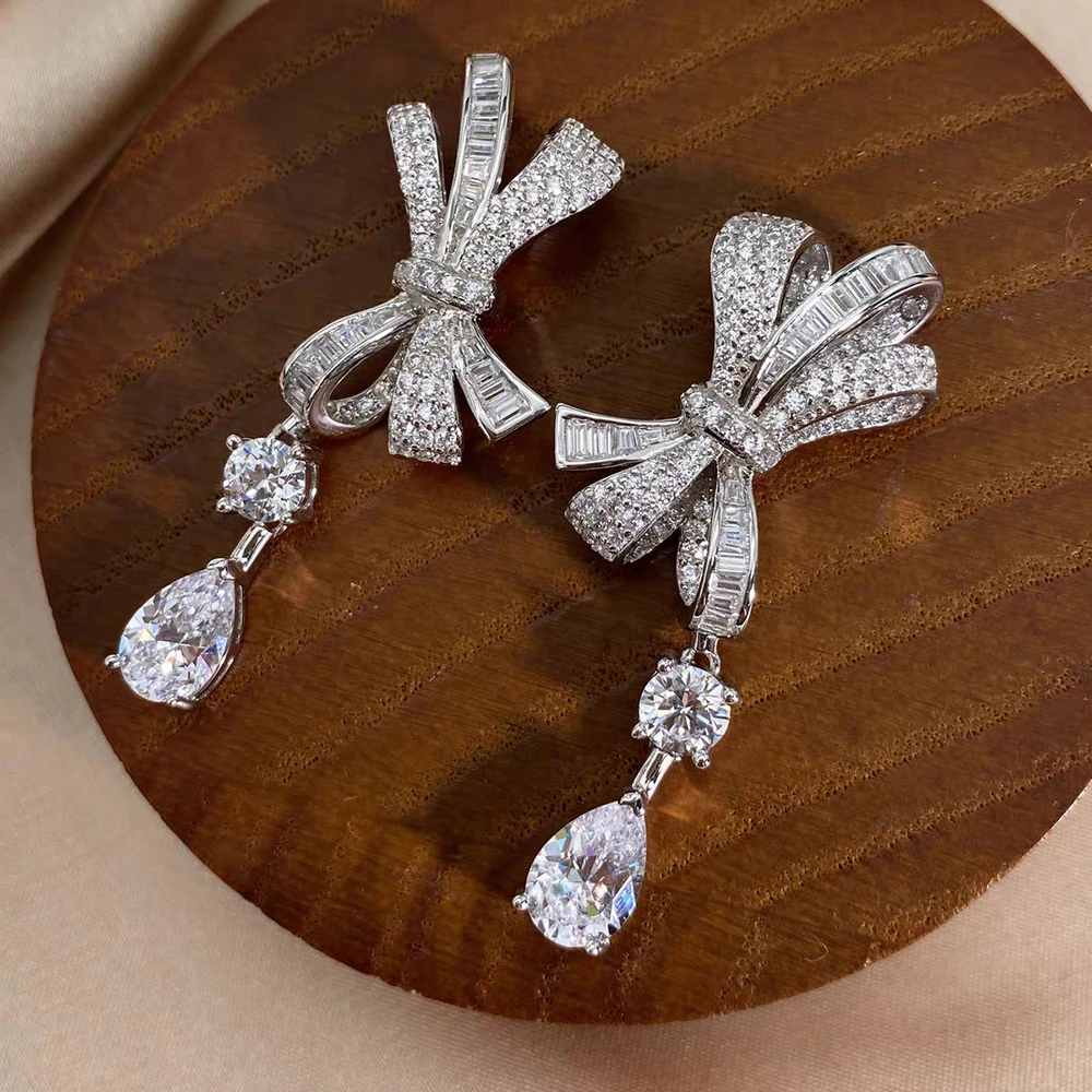925 Sterling Silver Full of Diamonds Bow Large AAA Zircon Pendant Earrings for Women Fashion Sparkling Luxury Brand Jewelry Gift
925 Sterling Silver Full of Diamonds Bow Large AAA Zircon Pendant Earrings for Women Fashion Sparkling Luxury Brand Jewelry Gift