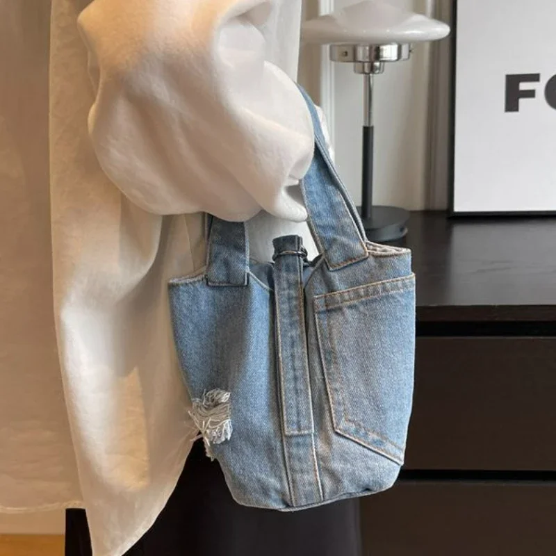 2023 Women Casual Washed Denim Bucket Bag Vintage Designer Patchwork Handbag Korean Y2k Harajuku Ripped Jeans Ladies Tote Bag
2023 Women Casual Washed Denim Bucket Bag Vintage Designer Patchwork Handbag Korean Y2k Harajuku Ripped Jeans Ladies Tote Bag