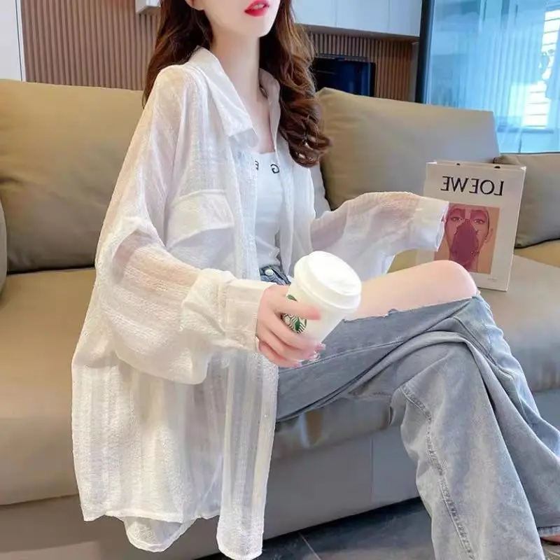 Summer New White Thin Loose Cardigan Long Sleeve Polo Neck Solid Color All-match Shirt Tops Trend Casual Fashion Women Clothing
Summer New White Thin Loose Cardigan Long Sleeve Polo Neck Solid Color All-match Shirt Tops Trend Casual Fashion Women Clothing