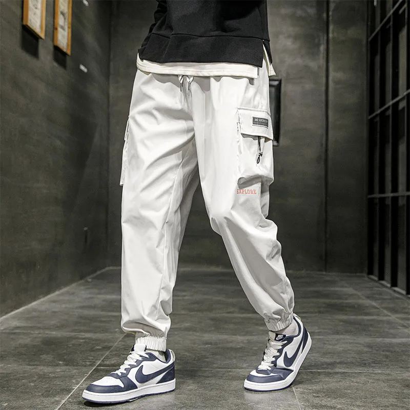 Spring Autumn New Solid Color Fashion Elastic Waist Cargo Pants Man High Street Loose Pockets Drawstring Ankle Length Trousers
Spring Autumn New Solid Color Fashion Elastic Waist Cargo Pants Man High Street Loose Pockets Drawstring Ankle Length Trousers