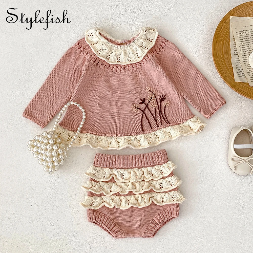 

autumn clothing for infants and young girls. Long sleeved knitted top with a ruffle collar and knitted pants with ruffles
