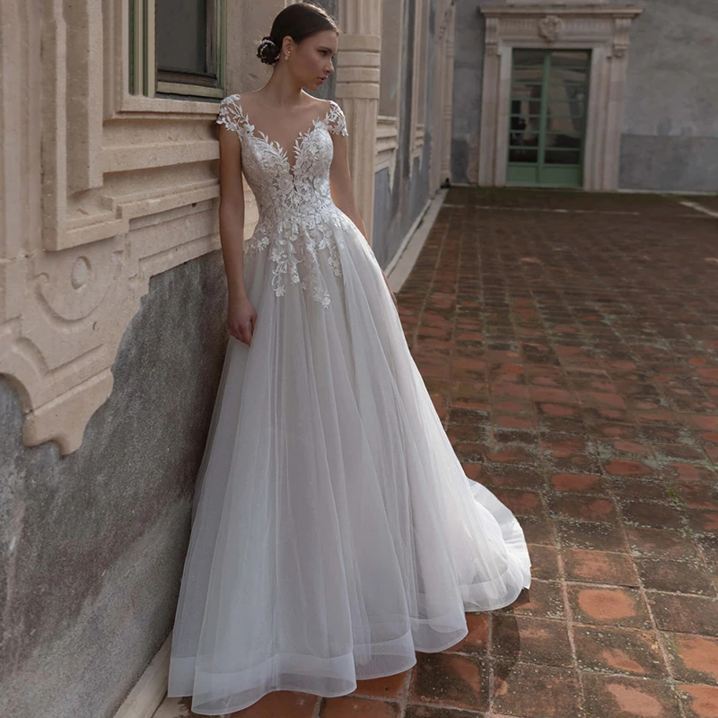 Sexy A-Line Deep V-Neck Wedding Dress 2024 Elegant Short Cap Sleeve Lace Appliques Bridal Gown Backless Button Tulle Sweep Train
Sexy A-Line Deep V-Neck Wedding Dress 2024 Elegant Short Cap Sleeve Lace Appliques Bridal Gown Backless Button Tulle Sweep Train
