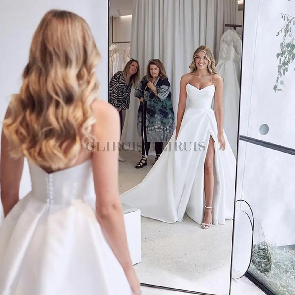 Simple Pleat V-neck Wedding Dress High SIde Slit Princess Bride Dress Bridal Gowns Back Buttons With Tail Marriage Gowns
Simple Pleat V-neck Wedding Dress High SIde Slit Princess Bride Dress Bridal Gowns Back Buttons With Tail Marriage Gowns