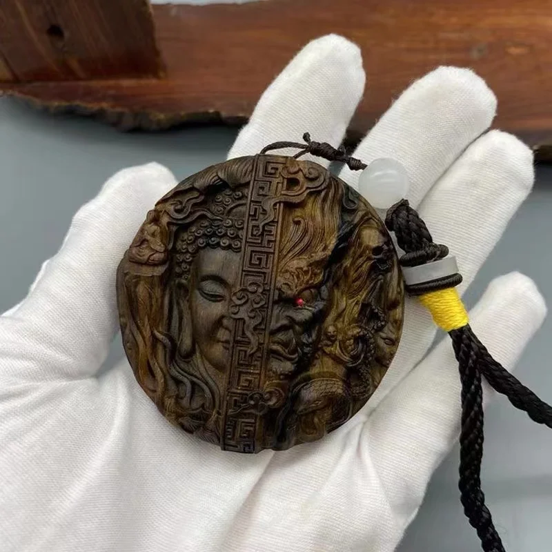 Hand carved Buddha and demon mind between hand play a piece of wood carving good and evil peace pendant handicraft pendant
Hand carved Buddha and demon mind between hand play a piece of wood carving good and evil peace pendant handicraft pendant
