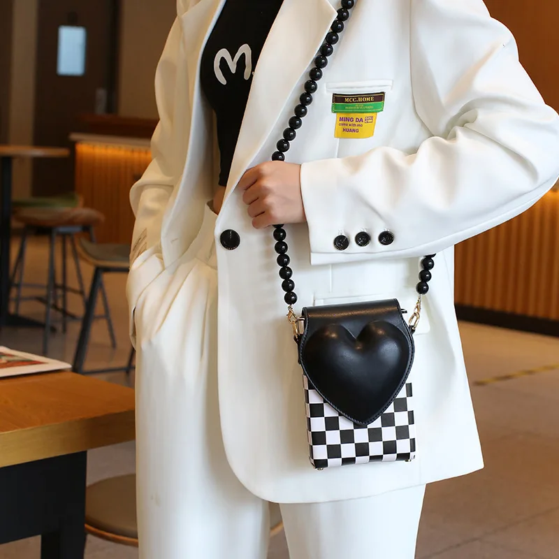 Korean version spade heart niche phone crossbody bag, simple and versatile beaded phone bag, small square phone shoulder bag
Korean version spade heart niche phone crossbody bag, simple and versatile beaded phone bag, small square phone shoulder bag