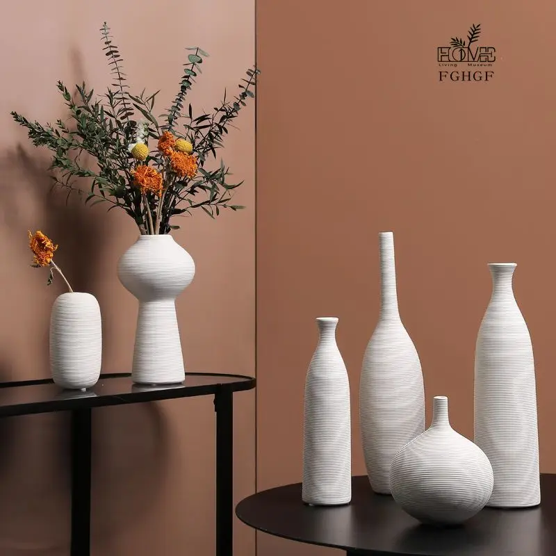 Nordic creative simple white ceramic vase living room entrance decorative ornaments plain flower arranging device
Nordic creative simple white ceramic vase living room entrance decorative ornaments plain flower arranging device