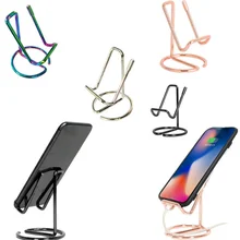 Simple universal tablet mobile phone holder mobile phone rack metal lazy iron electroplating mobile phone holder base ornaments
Simple universal tablet mobile phone holder mobile phone rack metal lazy iron electroplating mobile phone holder base ornaments