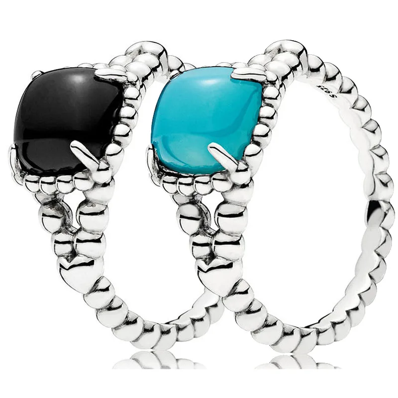 

Женское кольцо из серебра 925 пробы, с черным и синим кристаллом