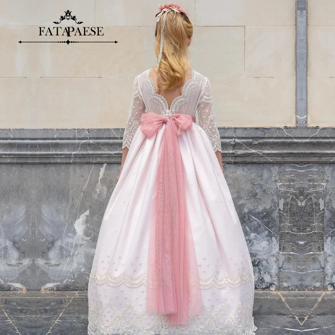 

FATAPAESE Long Sleeved Communion Dress with a Maxi and Flowing Multi-layer Skirt Floral Details in the Middle Pink Ribbon Belt