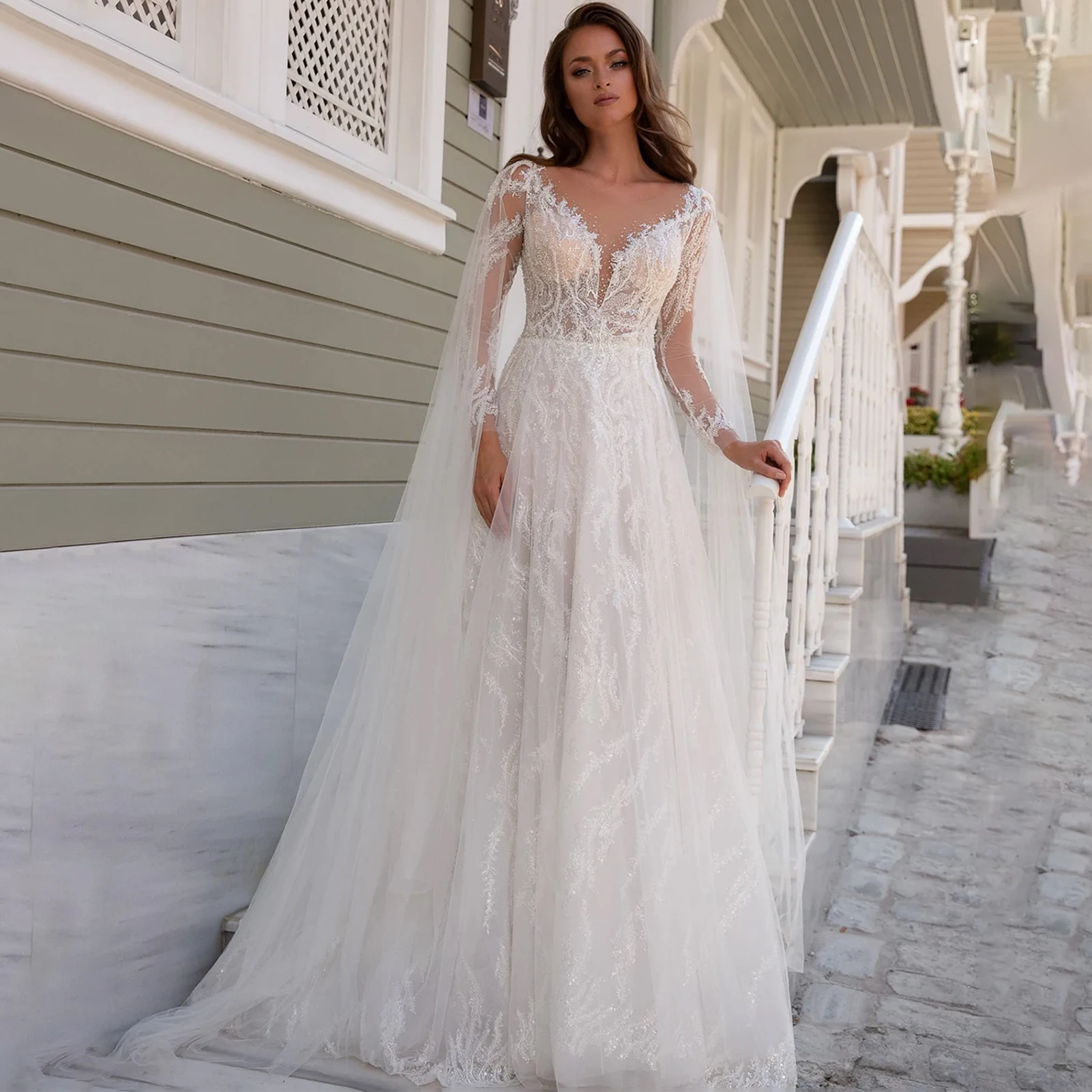

Illusion Sheer Neck Tulle Bridal Gown Brilliant Crystal Long Sleeve Wedding Dress Beading A-Line Sweep Train Vestido De Noiva