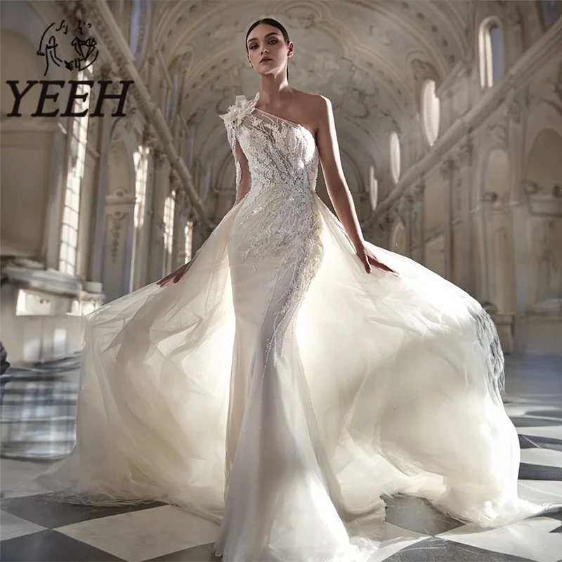 YEEH One-shoulder Lace Appliques Wedding Dress Illusion Bodice Bridal Gown with Detachable Sleeves Overskirt Vestido De Noiva
YEEH One-shoulder Lace Appliques Wedding Dress Illusion Bodice Bridal Gown with Detachable Sleeves Overskirt Vestido De Noiva