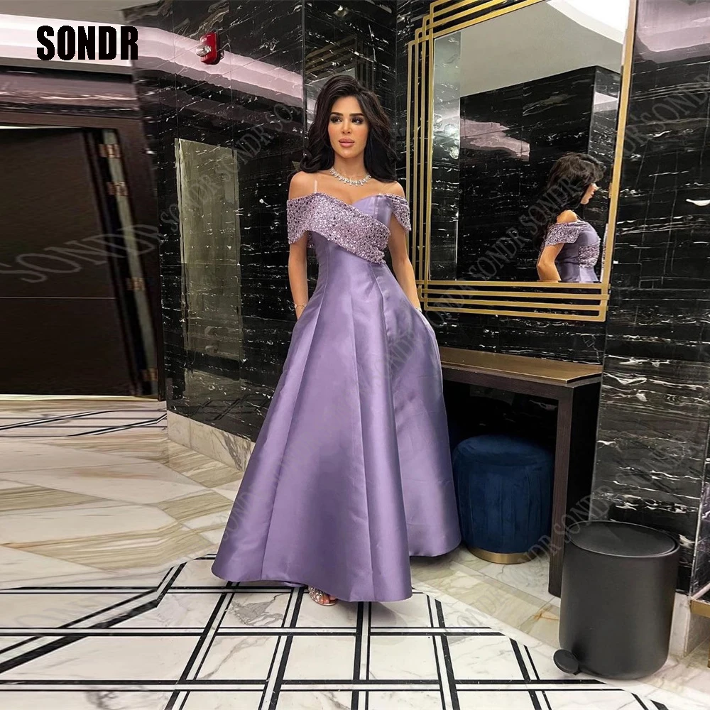SONDR Dark Purple Off Shoulder Shiny Outfits Sequins Satin A Line Gowns for Women Arabic Evening Cocktail Bridemaid Dress
SONDR Dark Purple Off Shoulder Shiny Outfits Sequins Satin A Line Gowns for Women Arabic Evening Cocktail Bridemaid Dress