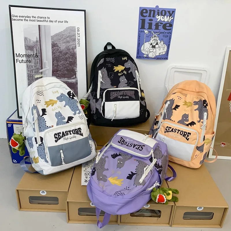 

Cute Dinosaur Pendant Backpacks for Girls Boys Designer Book Bags Concise School Bagpack Teenagers Couples Casual Satchel Bag