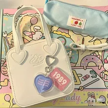 Kawaii Cell Phone Bag Cute Heart Handle Small Womens Handbag For Phone 2021 Crossbody Shoulder Bag Telfar Pouch
Kawaii Cell Phone Bag Cute Heart Handle Small Womens Handbag For Phone 2021 Crossbody Shoulder Bag Telfar Pouch