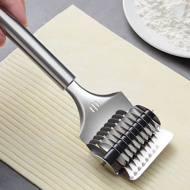Manual slicer stainless steel household rolling noodle cutting artifact chives noodle cutting kitchen gadgets.
Manual slicer stainless steel household rolling noodle cutting artifact chives noodle cutting kitchen gadgets.