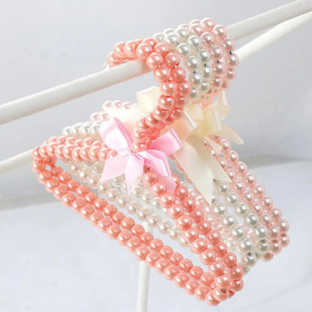 Clothes Hanger with Bow Non-slip ABS Children Faux Pearl Rack for Home Child Clothes Rack Pet Dog Mini Hangers Clothes Organizer
Clothes Hanger with Bow Non-slip ABS Children Faux Pearl Rack for Home Child Clothes Rack Pet Dog Mini Hangers Clothes Organizer