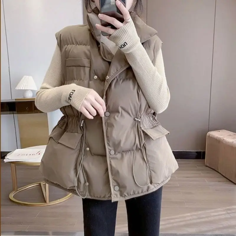 Women's Stand Collar Button Front Padded Vest Lightweight Slim Waist Drawstring Quilted Waistcoat Sleeveless Cotton Gilet
Women's Stand Collar Button Front Padded Vest Lightweight Slim Waist Drawstring Quilted Waistcoat Sleeveless Cotton Gilet
