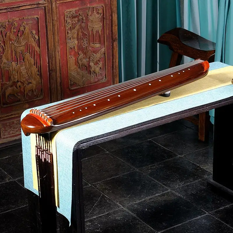 Chinese Traditional Exquisite Handmade Candlenut Small Guqin Beginner Practice Portable Guqin Seven-Stringed Plucked Instrument
Chinese Traditional Exquisite Handmade Candlenut Small Guqin Beginner Practice Portable Guqin Seven-Stringed Plucked Instrument