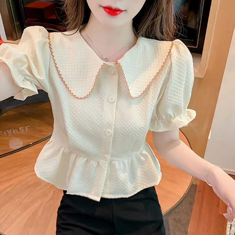 Sweet Peter Pan Collar Spliced Ruffles Button Puff Sleeve Shirt Summer Chic Tops Elegant Loose Female Clothing Commute Blouse
Sweet Peter Pan Collar Spliced Ruffles Button Puff Sleeve Shirt Summer Chic Tops Elegant Loose Female Clothing Commute Blouse