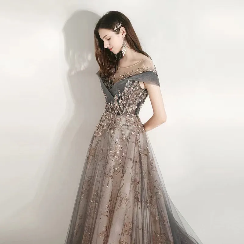 Luxury Off Shoulder Prom Dress A-Line Beading Exquisite Sequins Illusion Scoop Neck Gray Spray Gold Tulle Ceremony Evening Gowns
Luxury Off Shoulder Prom Dress A-Line Beading Exquisite Sequins Illusion Scoop Neck Gray Spray Gold Tulle Ceremony Evening Gowns