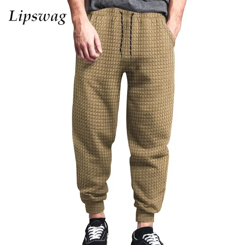 Streetwear Men's New Casual Pants Solid Color Waffle Loose Sweatpants For Men Spring Fashion Tie-up Drawstring Jogger Pants Male
Streetwear Men's New Casual Pants Solid Color Waffle Loose Sweatpants For Men Spring Fashion Tie-up Drawstring Jogger Pants Male