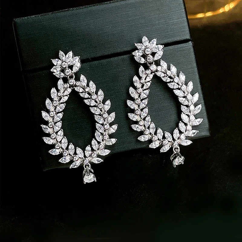 

2024 Fashionable and high-end 925 silver droplet earrings set with high carbon diamonds, luxurious and versatile new style