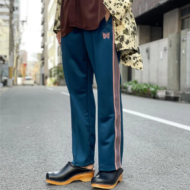 Sea Blue Needles Pants Men Women Stripe Butterfly Embroidery Logo Ribbon Needles Track Pants High Street Trousers
Sea Blue Needles Pants Men Women Stripe Butterfly Embroidery Logo Ribbon Needles Track Pants High Street Trousers
