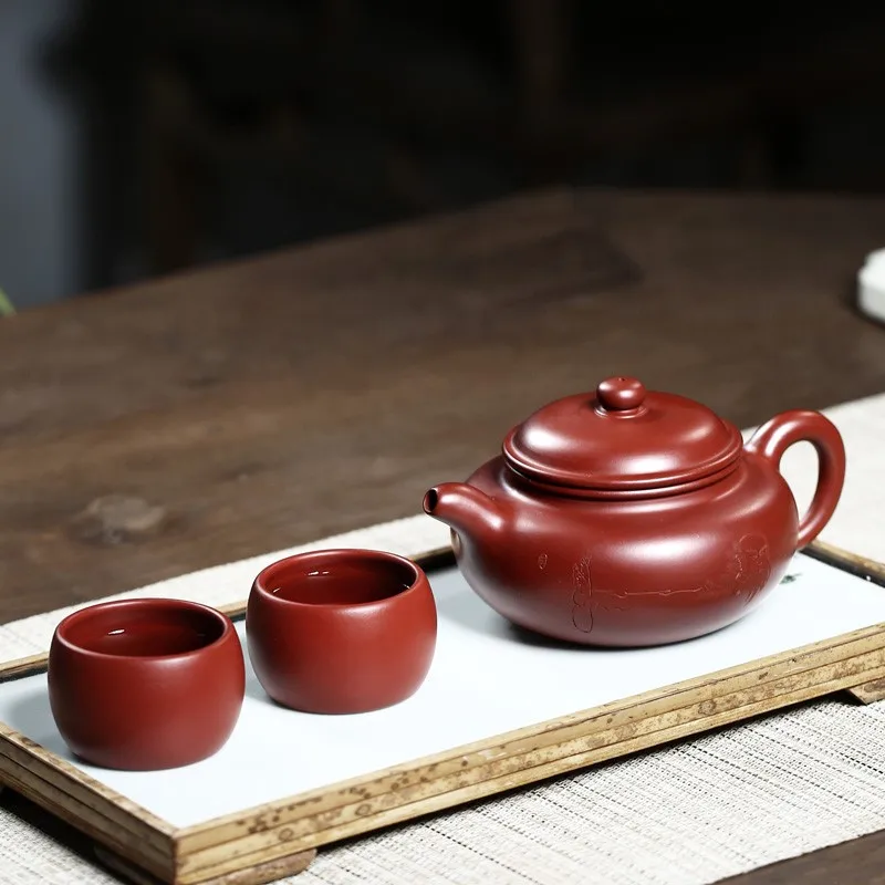 Home tea set purple clay teapot ore Dahongpao antique 290cc
Home tea set purple clay teapot ore Dahongpao antique 290cc